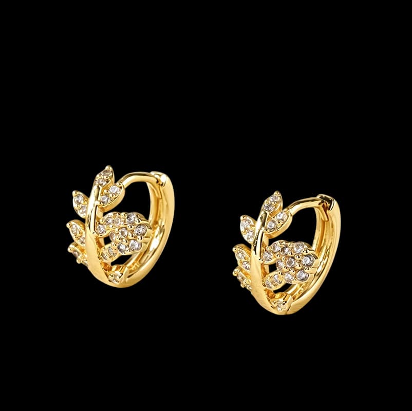 Golden-tone hoops with tiny flowers, leaves and clear decorative stones.