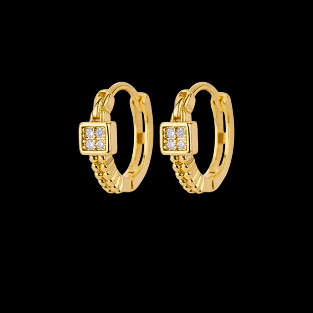 Golden-tone hoops with square settings holding four clear decorative stones.